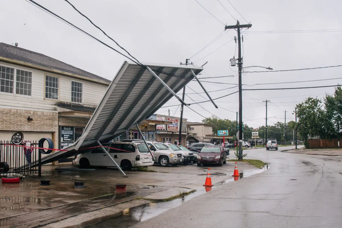 A carport hangs from power-lines after Tropical Storm Nicholas moved through the area in Houston, Texas, on Sept. 14, 2021. (Brandon Bell/Getty Images)