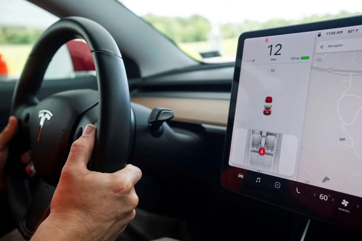 Joe Young, media relations associate for the Insurance Institute for Highway Safety (IIHS), demonstrates a front crash prevention test on a 2018 Tesla Model 3 at the IIHS-HLDI Vehicle Research Center in Ruckersville, Va., on July 22, 2019. (Amanda Voisard/Reuters)