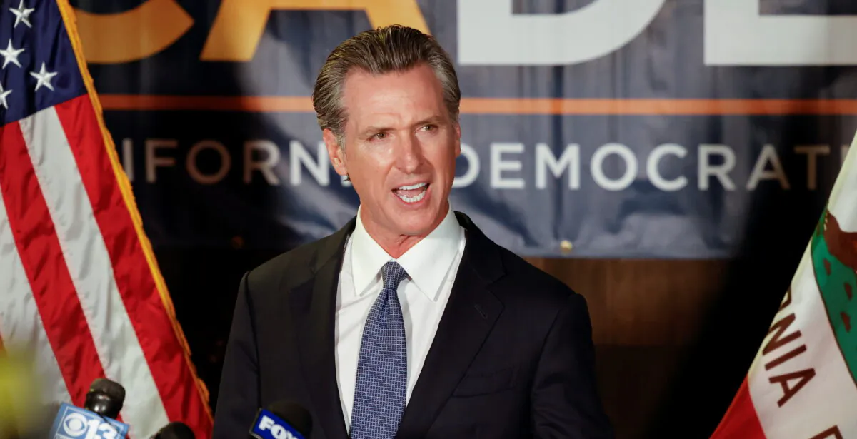 California Governor Gavin Newsom makes an appearance after the polls close on the recall election, at the California Democratic Party headquarters in Sacramento, Calif., on Sept. 14, 2021. (Fred Greaves/Reuters)