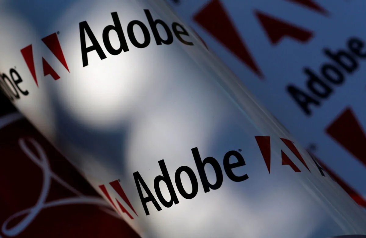 Adobe company logos are seen in this picture illustration taken in Vienna, on July 9, 2013. (Leonhard Foeger/Reuters)