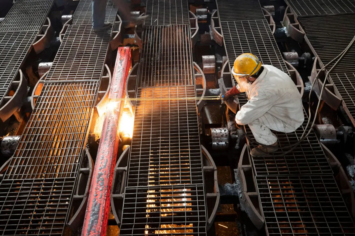 A worker makes an iron bar at a steel factory in Lianyungang, Jiangsu Province, China, on Feb. 12, 2021. (AFP via Getty Images)