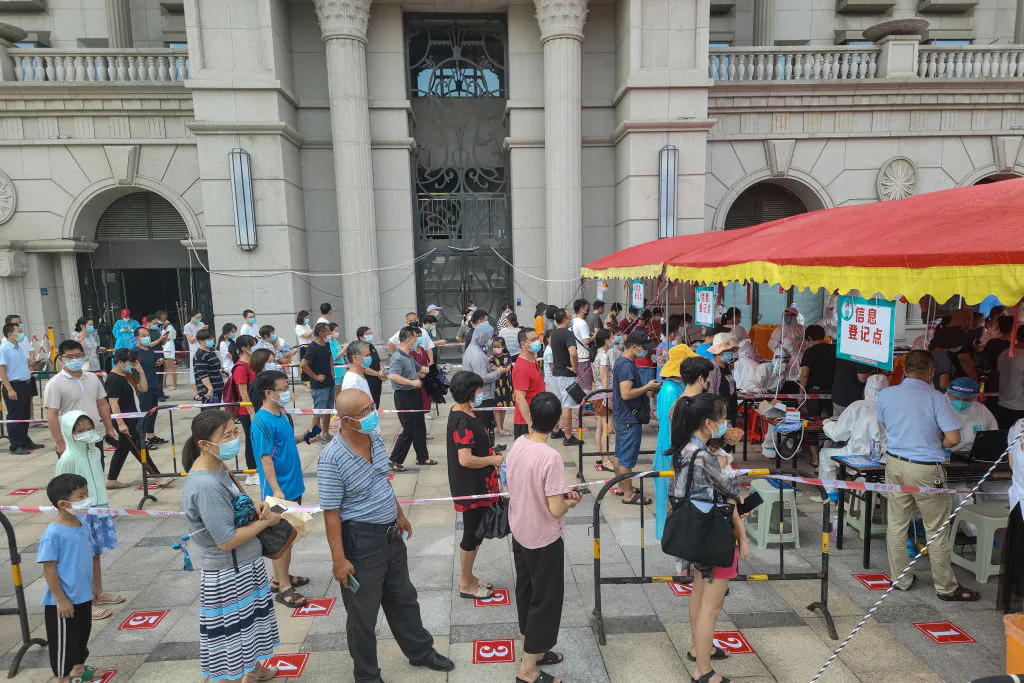 Residents queue to undergo nucleic acid tests for the COVID-19 coronavirus in Xiamen, in China's eastern Fujian Province on Sept. 14, 2021. (STR/AFP via Getty Images)