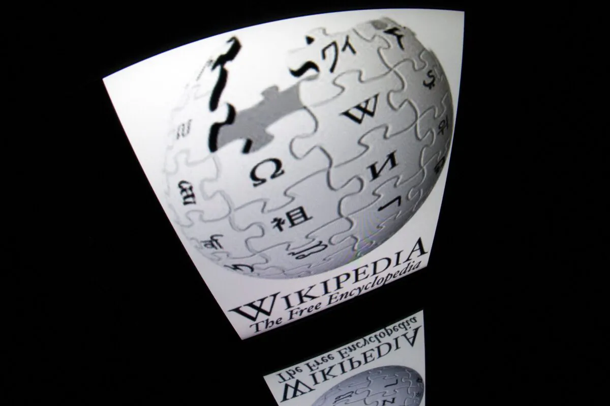 The "Wikipedia" logo is seen on a tablet screen in Paris, France on Dec. 4, 2012. (Lionel Bonaventure/AFP via Getty Images)