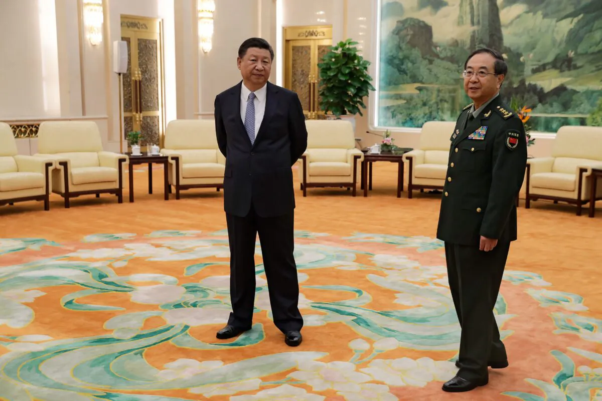 Chinese leader Xi Jinping (L) and General Fang Fenghui, chief of the general staff of the Chinese People's Liberation Army, wait to meet General Joseph Dunford, the chairman of the US joint chiefs of staff, at the Great Hall of the People in Beijing on August 17, 2017. (Andy Wong/AFP via Getty Images)