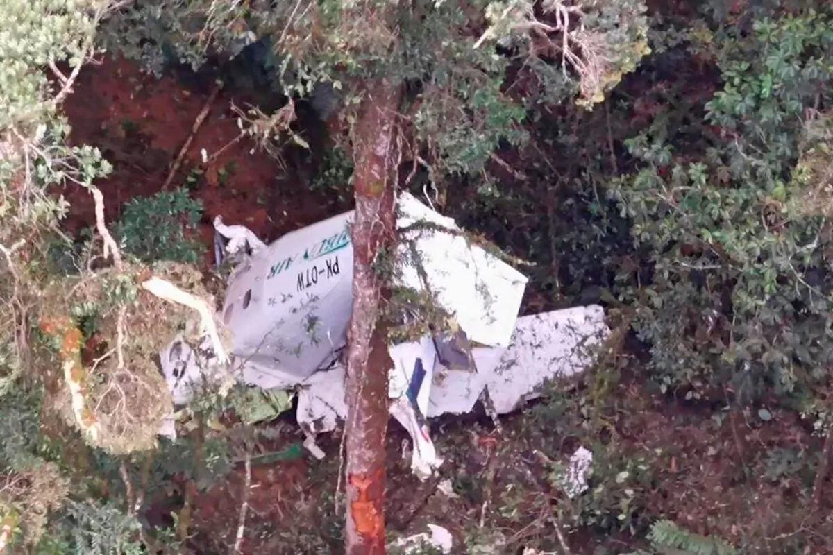 The wreckage of a small Rimbun Air cargo airplane is seen from a rescue helicopter in the mountain near Intan Jaya, Papua province, Indonesia, on Sept. 15, 2021. (Basarnas via AP)