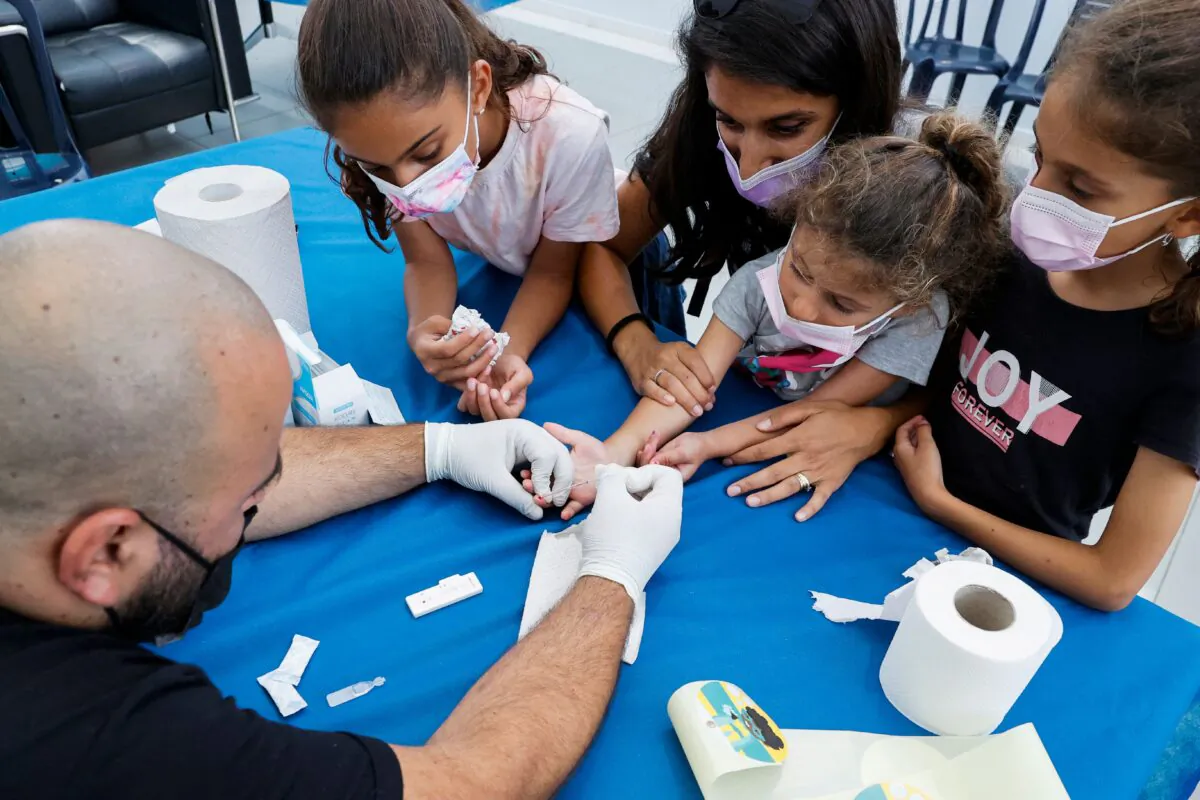 Children undergo COVID-19 antibody testing in a file photo. (Jack Guez/AFP via Getty Images)