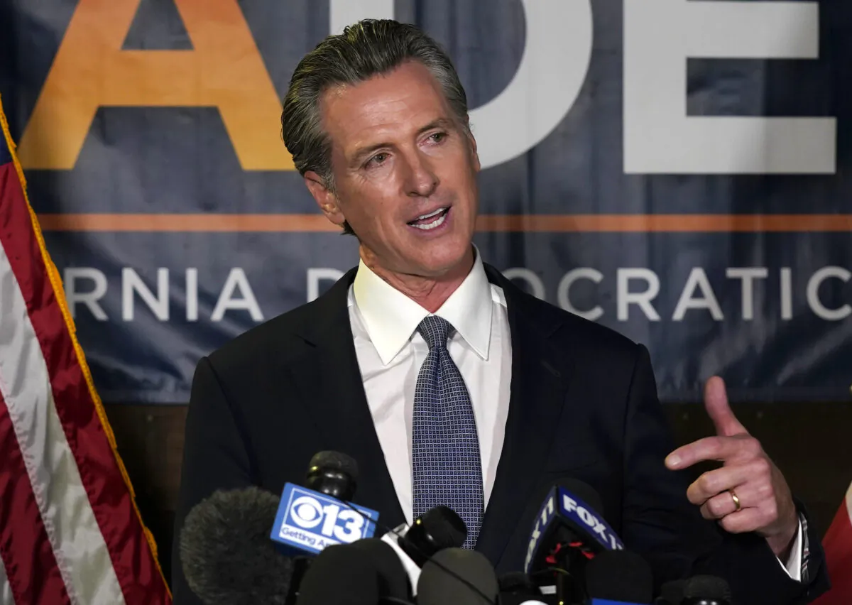 California Gov. Gavin Newsom addresses reporters at the John L. Burton California Democratic Party headquarters in Sacramento, Calif., on Sept. 14, 2021. (Rich Pedroncelli/AP Photo)