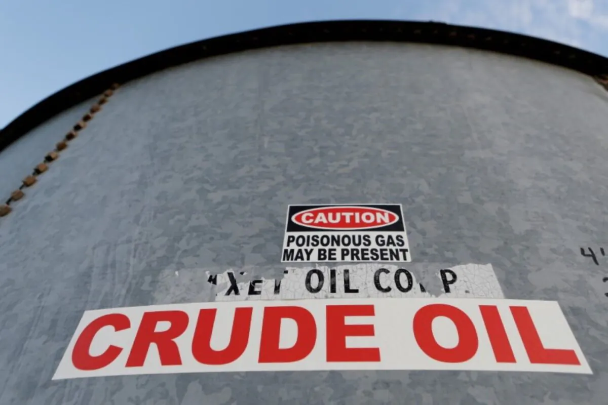 A sticker reads crude oil on the side of a storage tank in the Permian Basin in Mentone, Loving County, Texas, on Nov. 22, 2019. (Angus Mordant/Reuters)