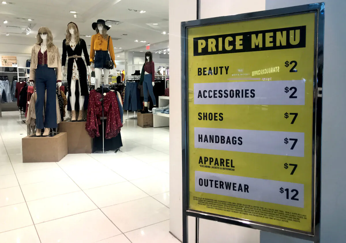 Sales on clothing and shoes are advertised at the entrance to a Forever 21 fashion retail store in downtown Toronto, Ontario, Canada, on Sept. 30, 2019.  (Chris Helgren/Reuters)