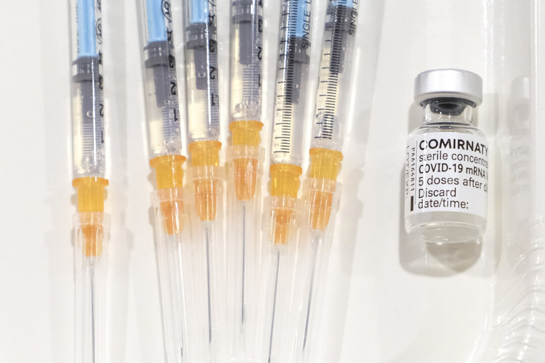 A vial of the Pfizer-BioNTech COVID-19 vaccine and vaccine-filled syringes during a national inoculation campaign against the virus at Chiba East Hospital in Chiba, Japan, on Feb. 19, 2021. (Kazuhiro Nogi/AFP via Getty Images)