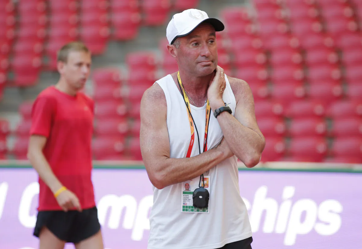 Coach Alberto Salazar stands in front of Galen Rupp of the USA at the World Athletics Championships in Beijing on Aug. 21, 2015. (Phil Noble/Reuters)