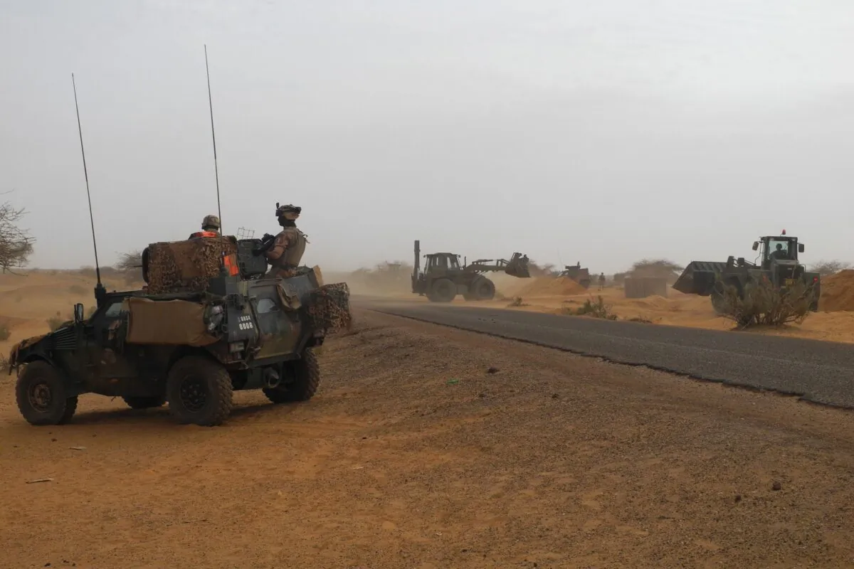 Two soldiers of the counter-terrorism Barkhane mission in Africa's Sahel region patrol aboard a Light Armored Vehicle (LAV) to observe the construction of the new French base in Gossi, center Mali, on March 25, 2019. (Daphne Benoit/AFP via Getty Images)