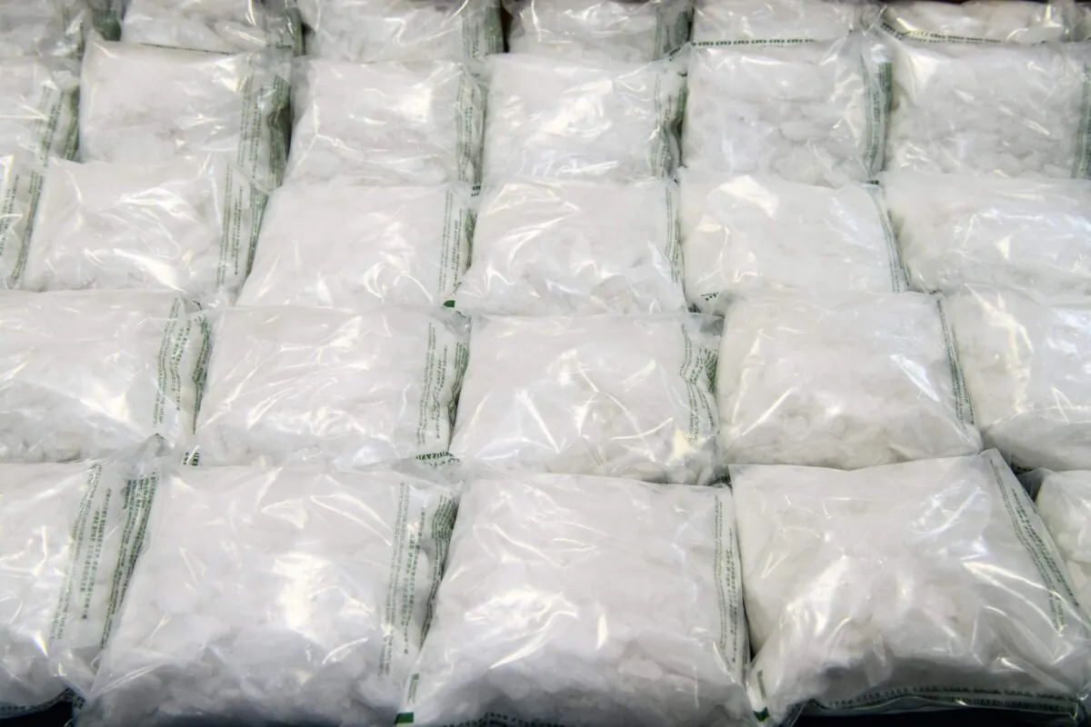 Packs of methamphetamine crystals are displayed behind a cordon during a press conference at the Customs Headquarters Building (CHB) in Hong Kong on Dec. 17, 2019. (Anthony Wallace/AFP via Getty Images)