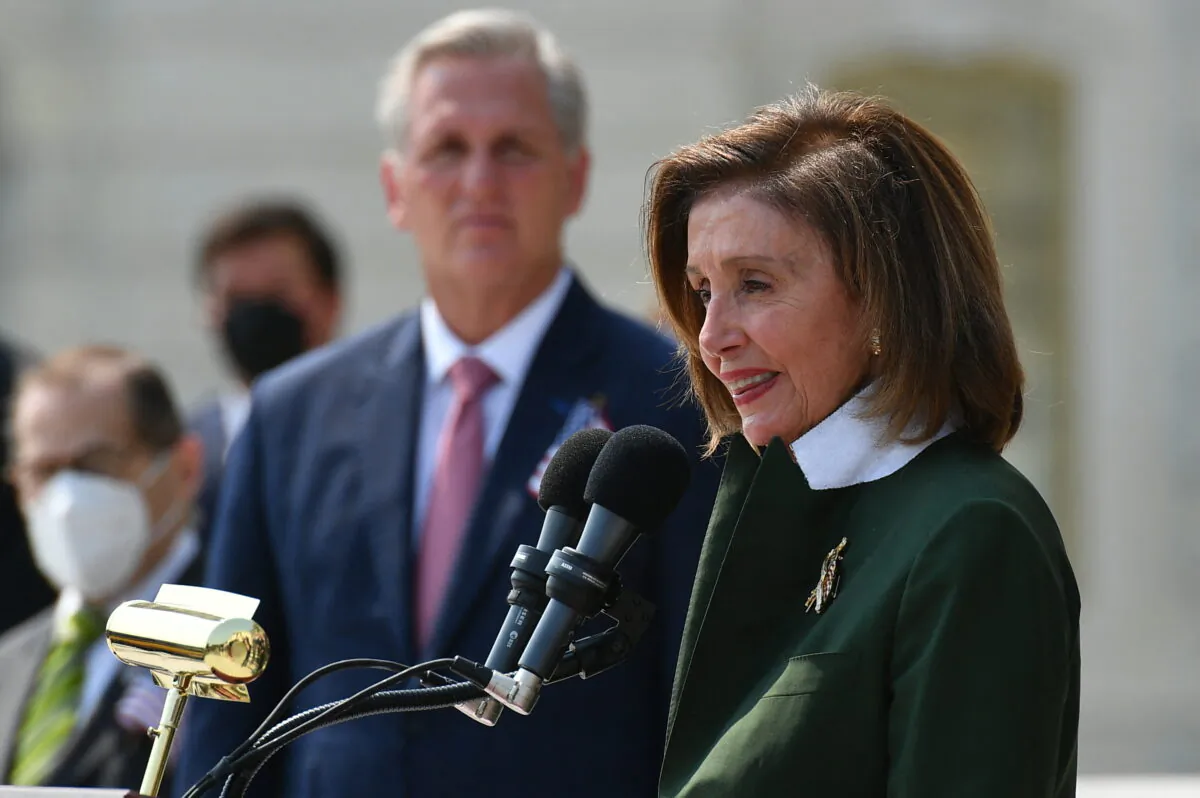 House Speaker Nancy Pelosi (D-Calif.) and other members of Congress take part in a ceremony to commemorate the 20th anniversary of the 9/11 attacks on the steps of the U.S. Capitol in Washington, on Sept. 13, 2021. (Mandel Ngan/AFP via Getty Images)