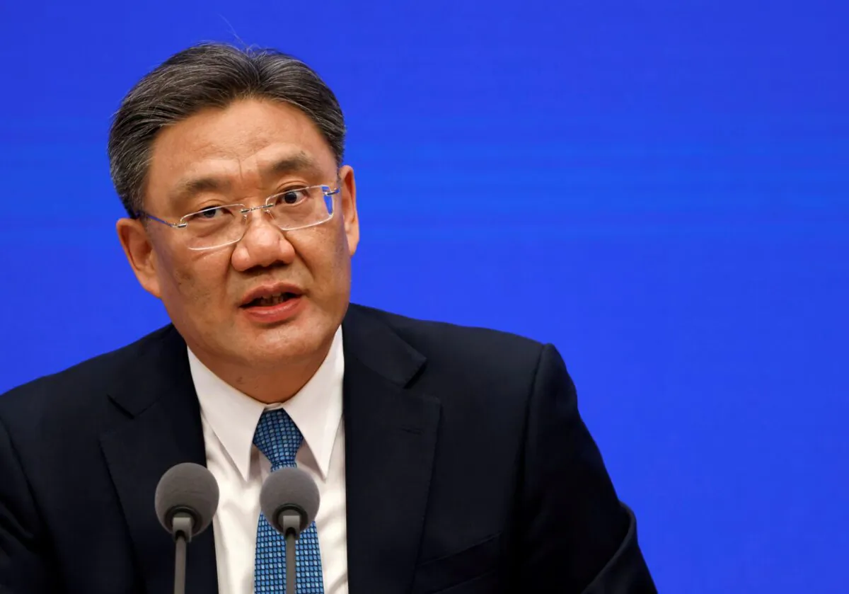 Chinese Commerce Minister Wang Wentao attends a State Council Information Office news conference in Beijing in China on Feb. 24, 2021. (Carlos Garcia Rawlins/Reuters)