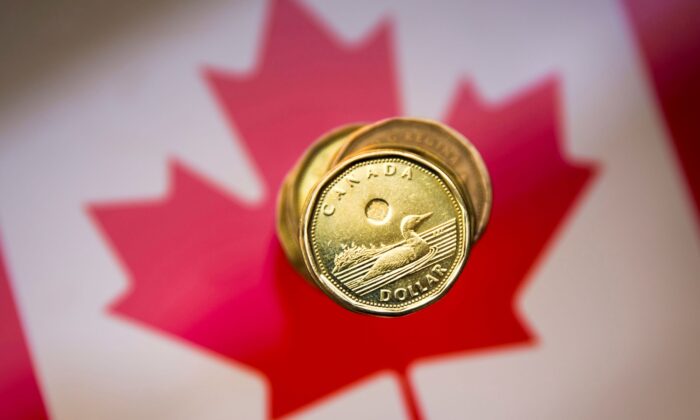 Analysts predict that the Canadian dollar will depreciate as global recession fears mount, even as oil prices could climb further and the Bank of Canada continues hiking interest rates. (Mark Blinch/Reuters)