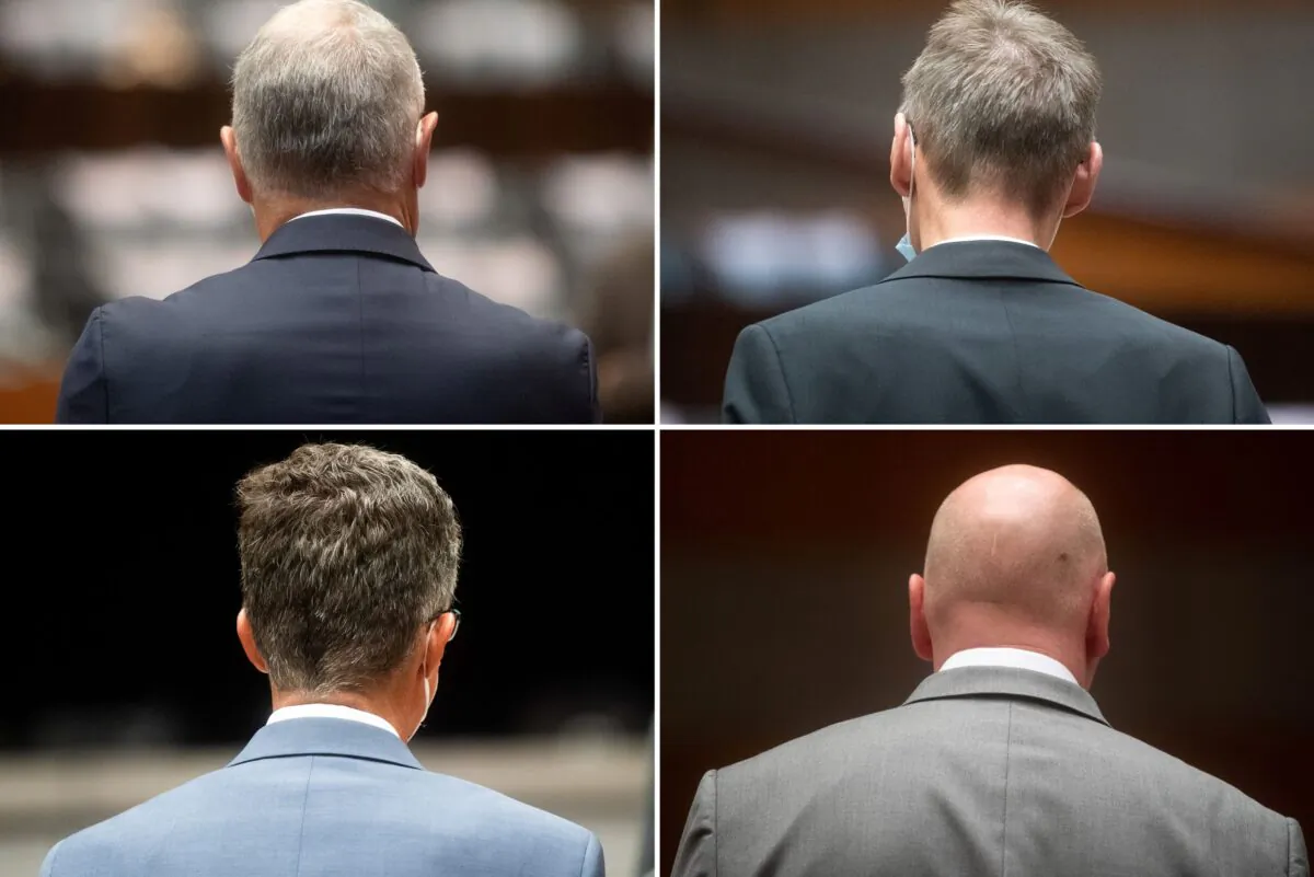 A combination picture shows the four defendants at the start of the trial of former Volkswagen executives charged with misconduct over their role in the carmaker's manipulation of diesel emissions testing, in Brunswick, Germany on Sept. 16, 2021. (Julian Stratenschulte/Pool via Reuters)