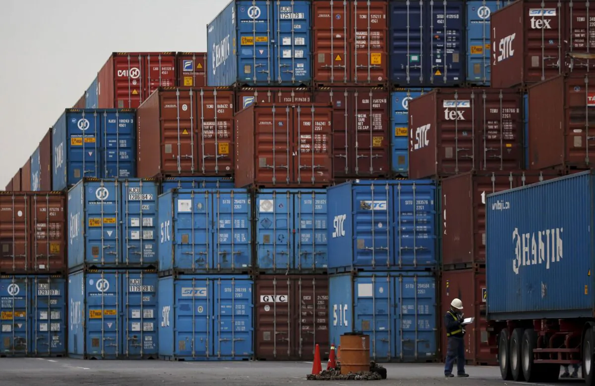 A laborer works in a container area at a port in Tokyo, Japan on March 16, 2016. (Toru Hanai/Reuters)