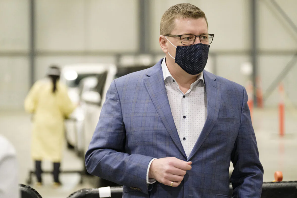 Saskatchewan Premier Scott Moe during a tour of the COVID-19 mass immunization clinic and drive-thru immunization space at International Trade Centre in Regina on Feb. 18, 2021. (The Canadian Press/Michael Bell)