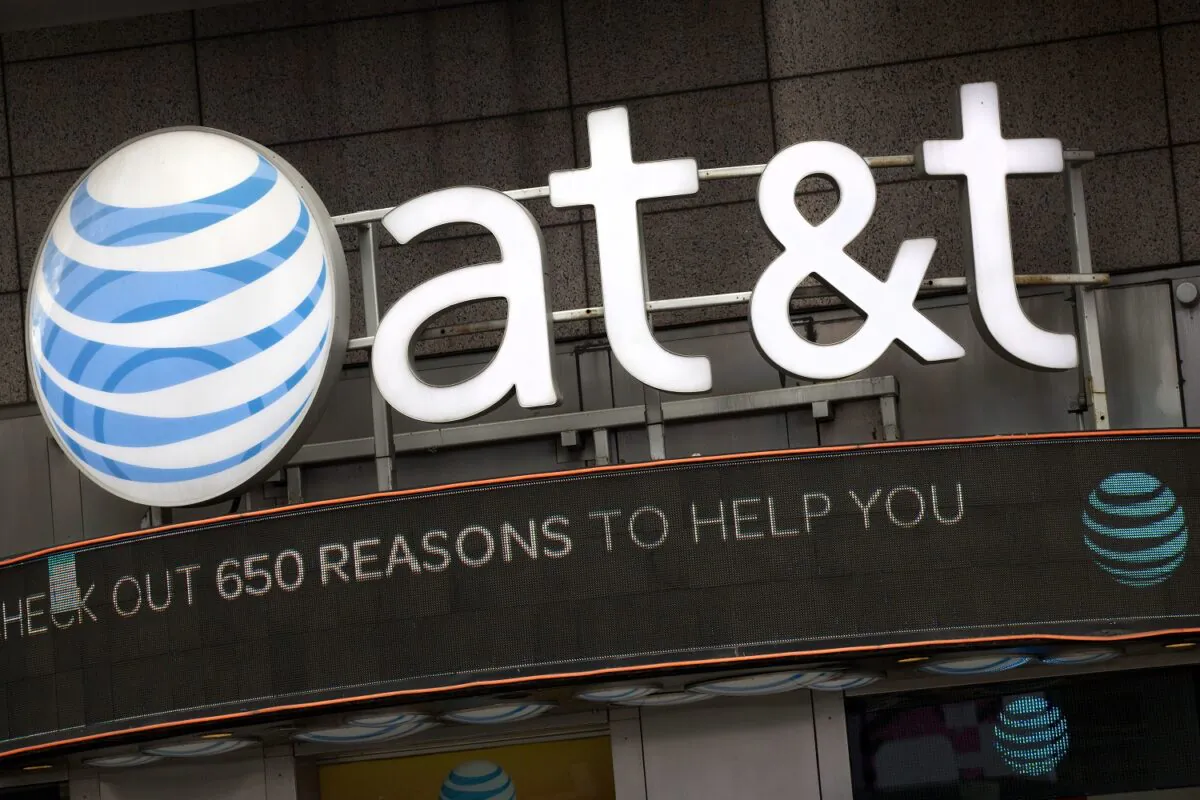 The AT&T logo is positioned above one of its retail stores, in New York on Oct. 24, 2016. (Mark Lennihan/AP Photo)