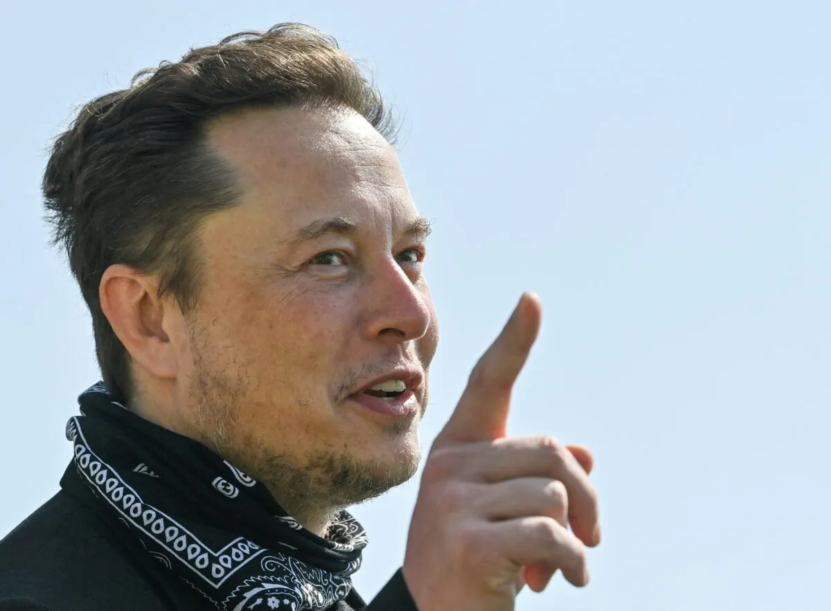 Tesla CEO Elon Musk gestures as he visits the construction site of Tesla's Gigafactory in Gruenheide near Berlin, Germany, on Aug. 13, 2021. (Patrick Pleul/Pool via Reuters)