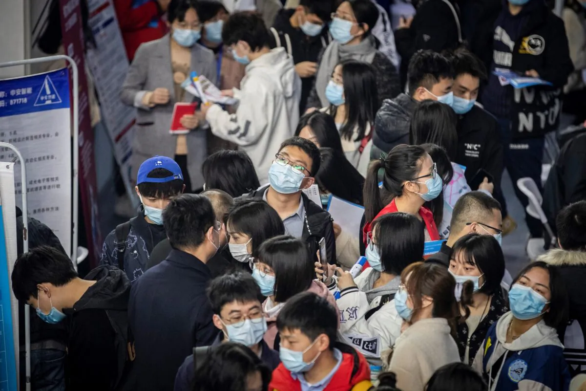 University graduates attend a career fair in Wuhan, in central China's Hubei Province on March 21, 2021. (STR/AFP)