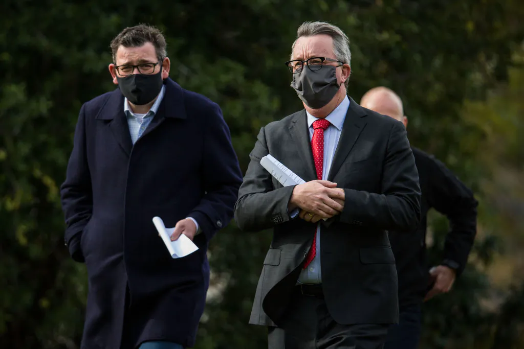 Victorian Premier, Daniel Andrews, Health Minister, Martin Foley and Victorian COVID-19 Testing Commander, Jeroen Weimar arrive at the daily press conference on July 27, 2021 in Melbourne, Australia. (Darrian Traynor/Getty Images)