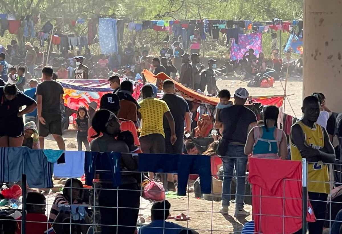Migrants stand by the International Bridge between Mexico and the U.S., in Del Rio, Texas, on Sept. 16, 2021. (Office of U.S. Congressman Tony Gonzales/via Reuters)