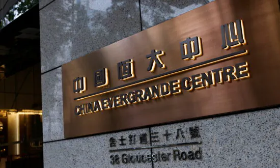 China Evergrande Halts Electric Car Unit’s Listing Plan, Shares Tumble