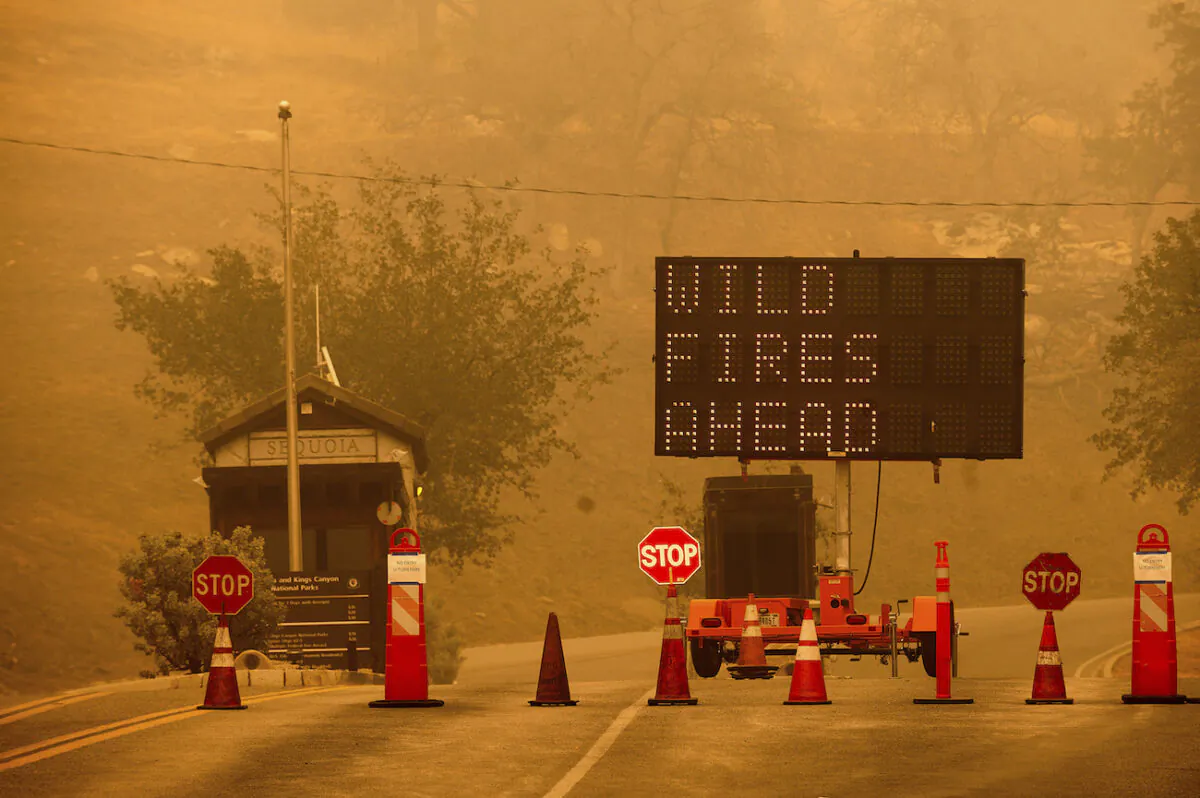 Cones block the entrance to Sequoia National Park, Calif., as the KNP Complex Fire burns nearby, on Sept. 15, 2021. (AP Photo/Noah Berger)