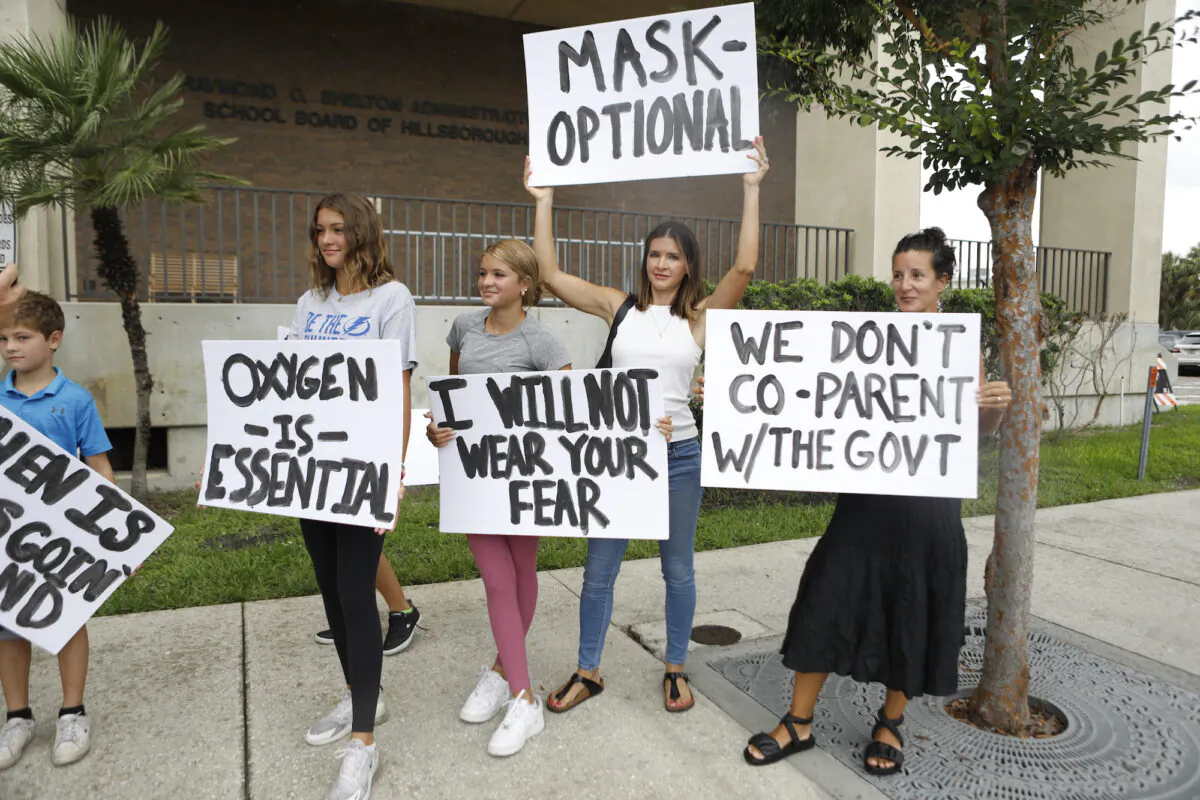 Families protest any potential mask mandates before the Hillsborough County Schools Board meeting held at the district office on July 27, 2021 in Tampa, Florida. (Octavio Jones/Getty Images)