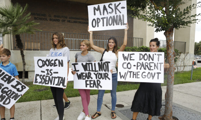 Families protest any potential mask mandates before the Hillsborough County Schools Board meeting held at the district office on July 27, 2021 in Tampa, Florida. (Octavio Jones/Getty Images)