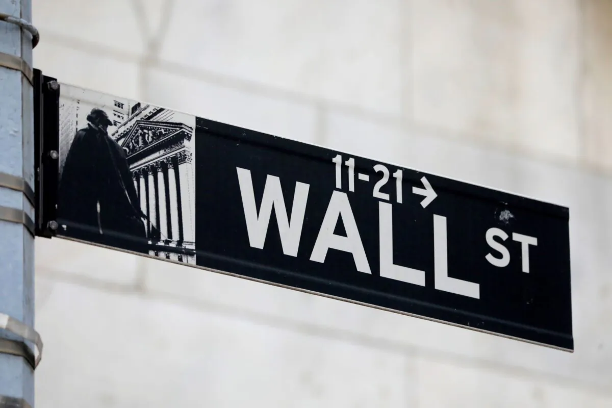 A street sign for Wall Street is seen outside of the New York Stock Exchange (NYSE) in New York City, N.Y., on June 28, 2021. (Andrew Kelly/Reuters)