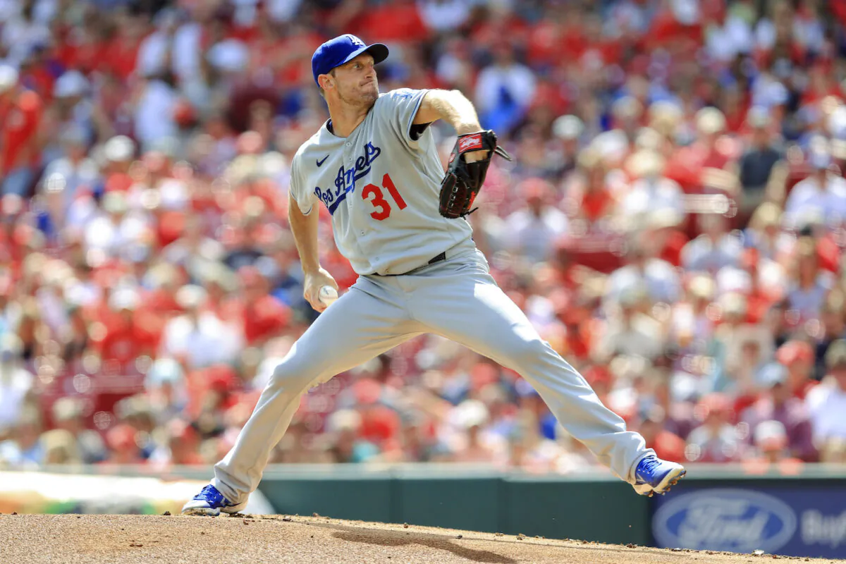 Los Angeles Dodgers' Max Scherzer throws during the first inning of a baseball game against the Cincinnati Reds in Cincinnati on Sept. 18, 2021. (AP Photo/Aaron Doster)