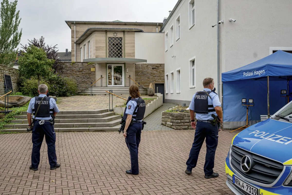 Police officers stay in front of the entrance to the Jewish Community bodybuilding in Hagen, Germany, on Sept. 16, 2021. (Henning Kaiser/dpa via AP)
