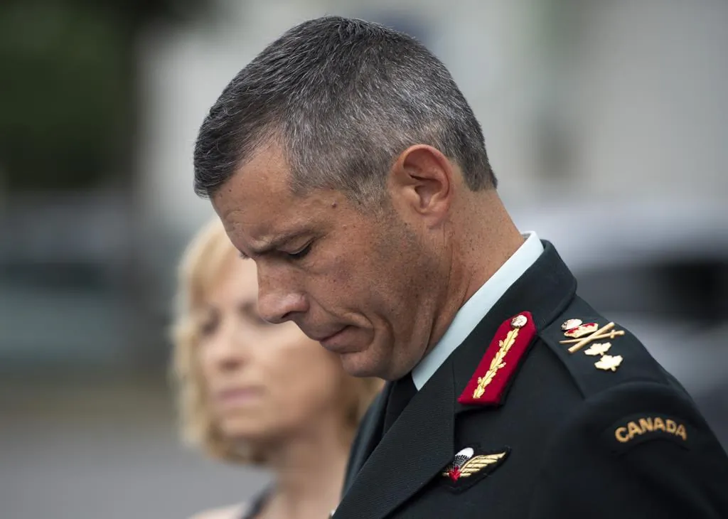 Maj.-Gen. Dany Fortin speaks to reporters outside the Gatineau Police Station after being processed, in Gatineau, Que., on Aug. 18, 2021. (The Canadian Press/Justin Tang)