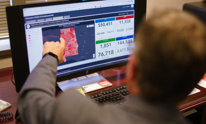 Dr. Scott Harris, Alabama's state health officer, points at a computer screen in his office in Montgomery, Ala., on June 29, 2021. (Elijah Nouvelage/AFP via Getty Images)