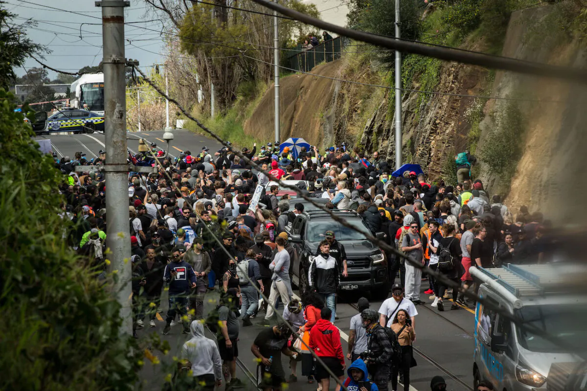 Protesters clash with members of Victoria Police on Barkers Road in Hawthorn in Melbourne, Australia, on Sept. 18, 2021. (Darrian Traynor/Getty Images)