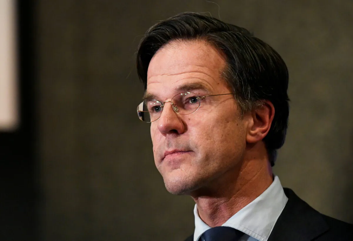 Dutch Prime Minister Mark Rutte reacts to the exit polls in the Netherlands' general election in The Hague, Netherlands, on March 17, 2021. (Piroschka Van De Wouw/Pool via Reuters)
