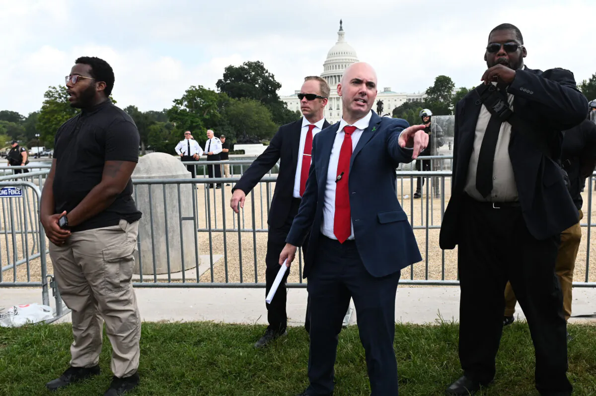 Matt Braynard (C), executive director of 'Look Ahead America,' gestures as protesters gather for the "Justice for J6" rally in Washington on Sept. 18, 2021. (Roberto Schmidt/AFP via Getty Images)