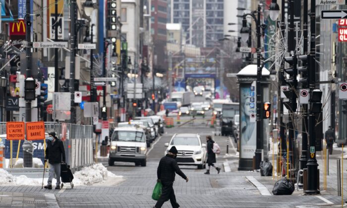 A quiet Saint-Catherine Street in Montreal under Quebec's new COVID-19 lockdown measures, including a curfew, on Jan. 11, 2021. (The Canadian Press/Paul Chiasson)