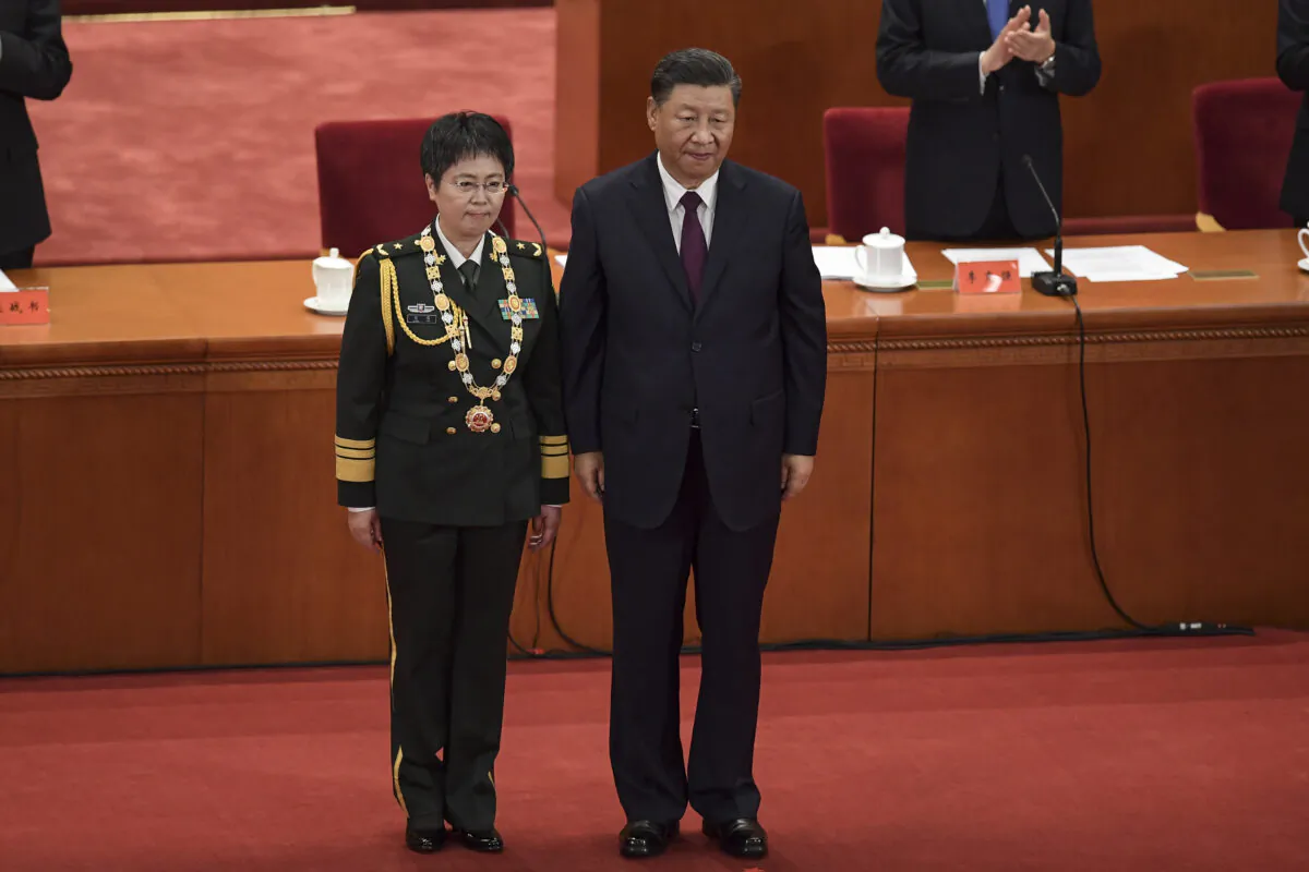 Maj. Gen. Chen Wei (L) receives an award from Chinese leader Xi Jinping during a ceremony to honour people who fought against the pandemic, at the Great Hall of the People in Beijing on Sept. 8, 2020. (Nicolas Asfouri/AFP via Getty Images)
