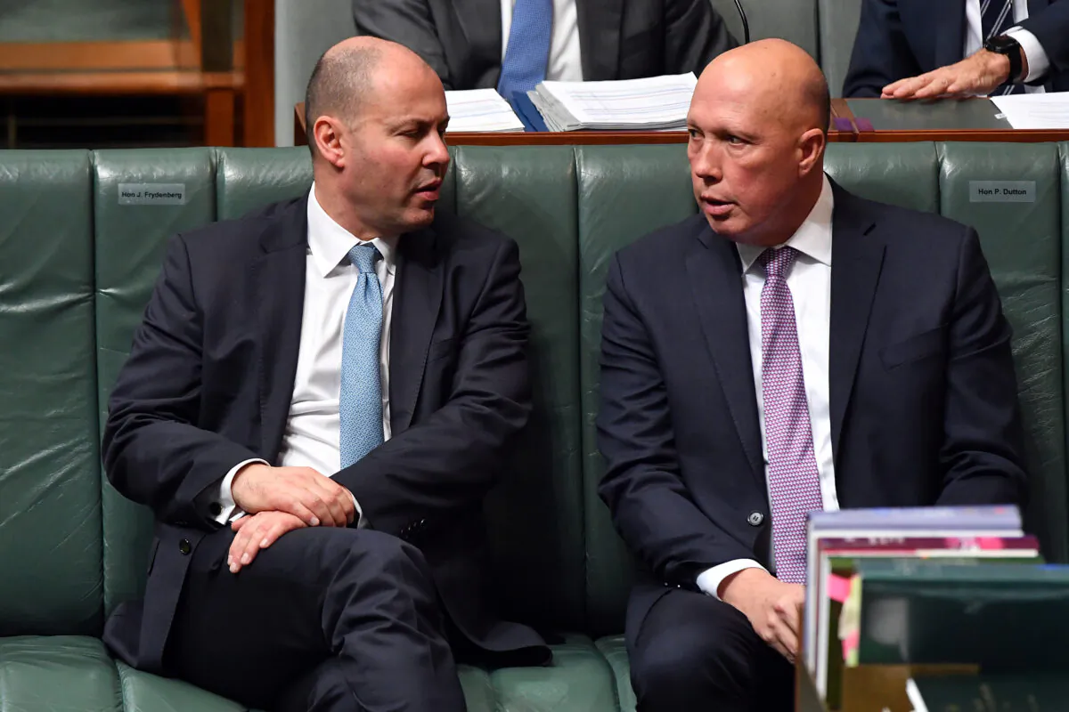 Australian Treasurer Josh Frydenberg speaks to Minister for Defence Peter Dutton during Question Time in the House of Representatives at Parliament House in Canberra, Australia, on June 22, 2021. (Sam Mooy/Getty Images)