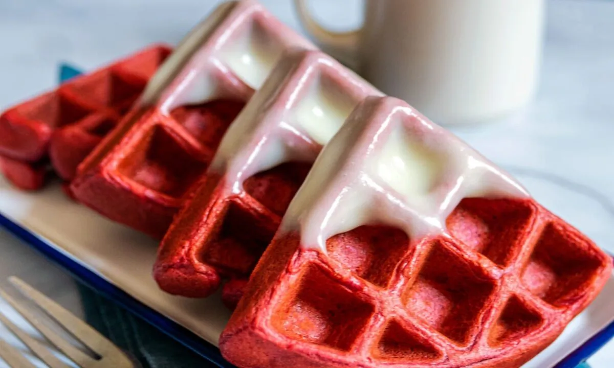 The tangy cream cheese glaze perfectly complements the sweet waffles—drizzle it on top, or dunk the waffles in like donuts. (Perry Santanachote/TNS)