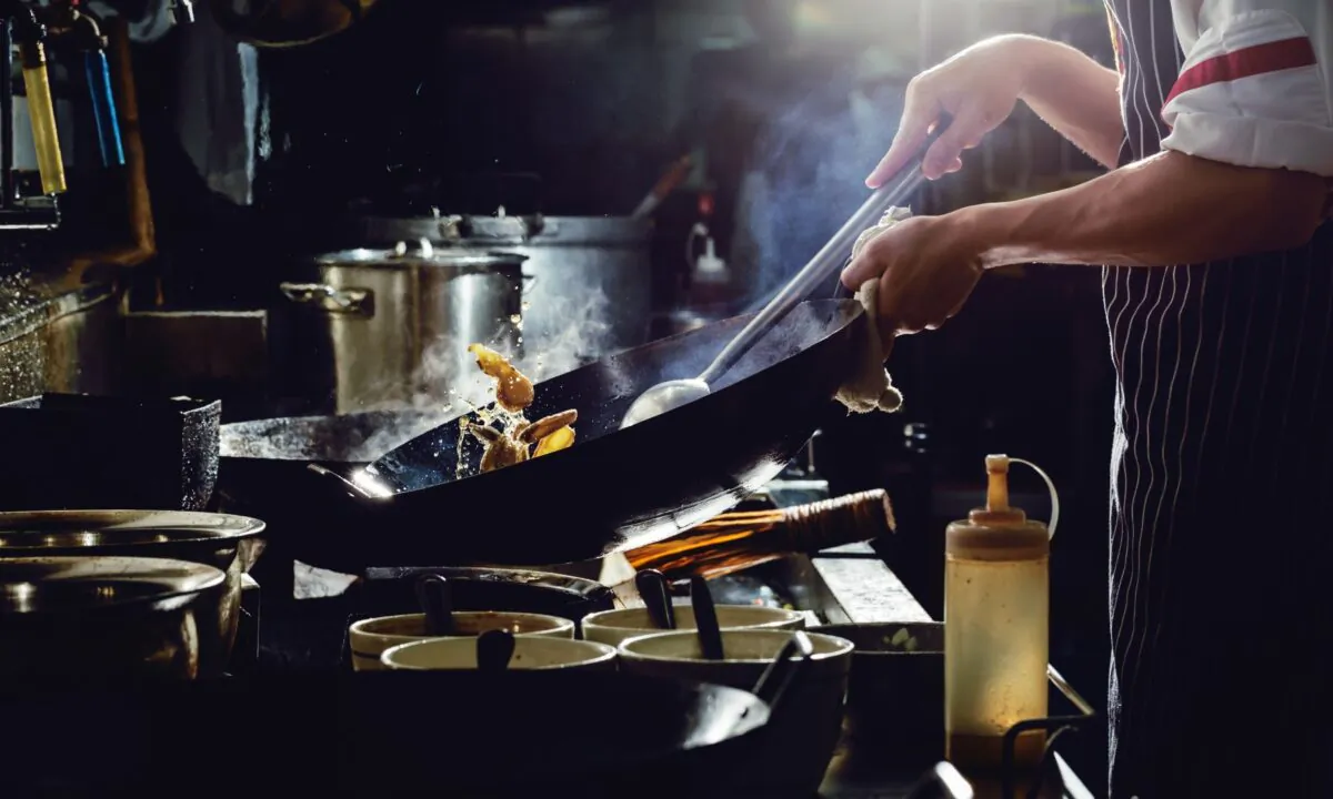 Start with a heavy wok and high heat. (U2M Brand/shutterstock)