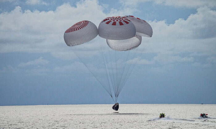 The quartet of newly minted citizen astronauts comprising the SpaceX Inspiration4 mission safely splashes down in SpaceX's Crew Dragon capsule off the coast of Kennedy Space Center, Florida, on Sept, 18, 2021. (SpaceX/Handout via Reuters)