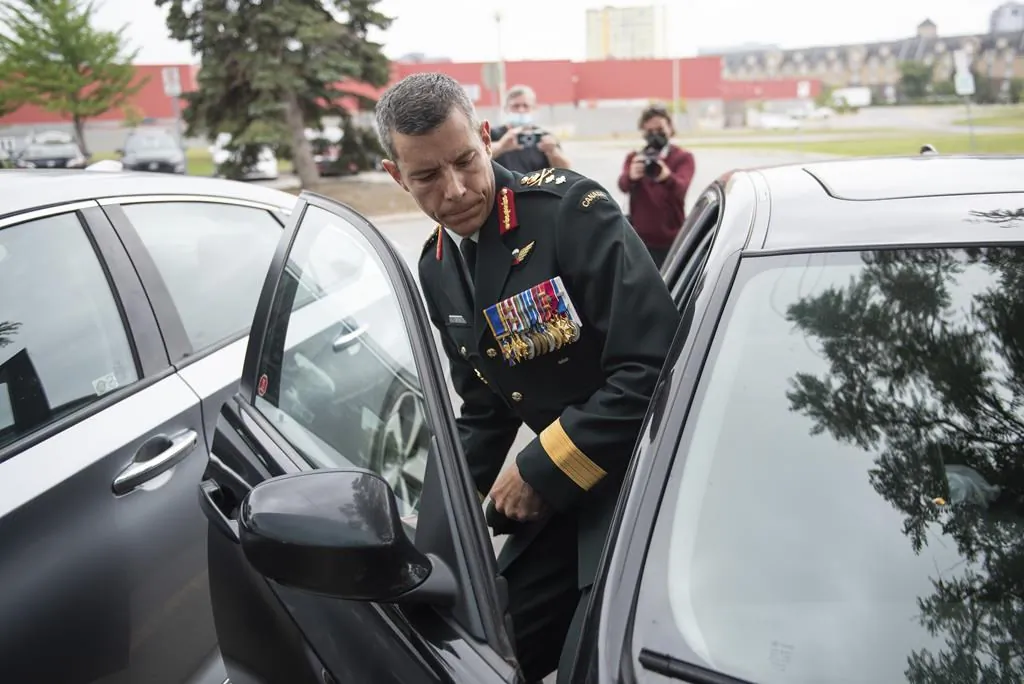 Maj.-Gen. Dany Fortin leaves the Gatineau Police Station after being processed, in Gatineau, Que., on Aug. 18, 2021. (The Canadian Press/Justin Tang)