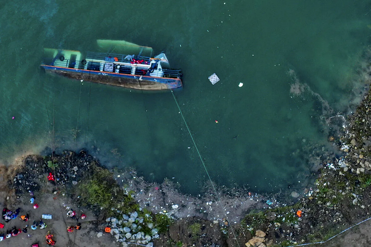 The site of an overturned passenger ship in Liupanshui in southwest China's Guizhou Province on Sept. 19, 2021. (Ou Dongqu/Xinhua via AP)