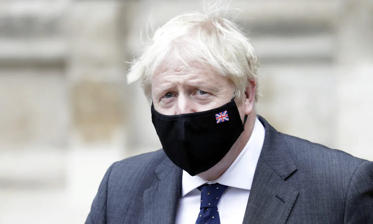 British Prime Minister Boris Johnson departs the Battle of Britain 81st Anniversary Service of Thanksgiving and Rededication at Westminster Abbey in London on Sept. 19, 2021. (John Phillips/Getty Images)