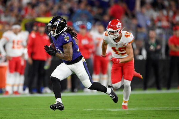 Baltimore Ravens running back Devonta Freeman (L)